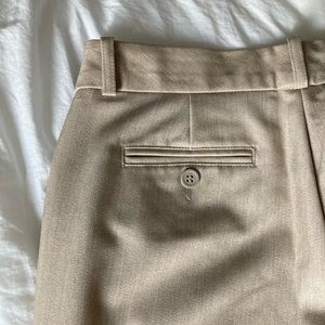 Very lightly worn, tan work pants with bootleg/flare. Size 4.